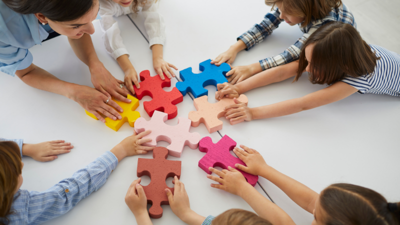 Children solving puzzles in a classroom setting